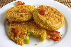 Crispy golden fried snacks with bacon pieces on top.