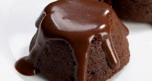 A rich chocolate lava cake with molten chocolate oozing out.