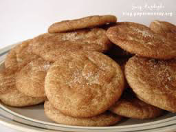 A plate of cinnamon sugar cookies stacked together.