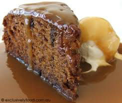 Slice of chocolate cake with caramel sauce and vanilla ice cream.