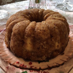 A bundt cake on a decorative plate.