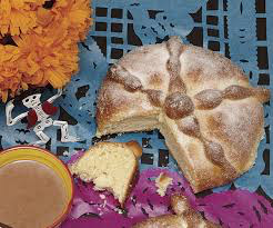 Traditional Mexican bread and warm drink on a festive table.