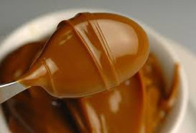 A caramel candy with a shiny surface.