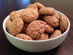 A bowl filled with crunchy ginger cookies.