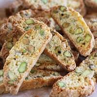 Close-up of crunchy pistachio biscotti slices.