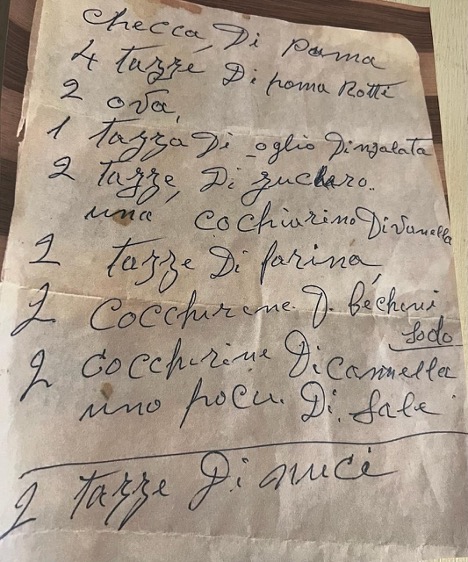 Handwritten list of Italian dishes including pasta and cocktails.