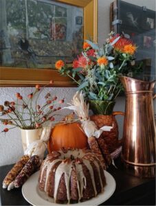 Autumn display with cake and decorations.