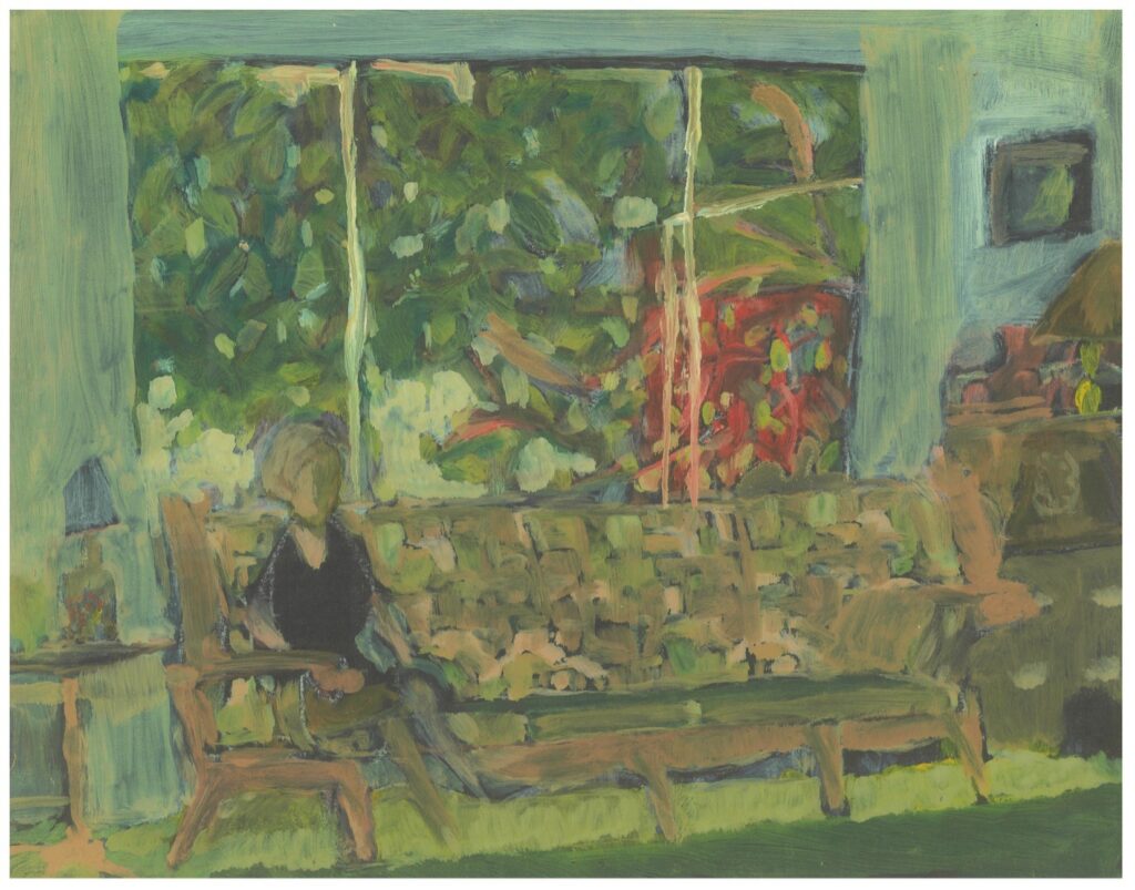 Person sitting on couch, vibrant window view.