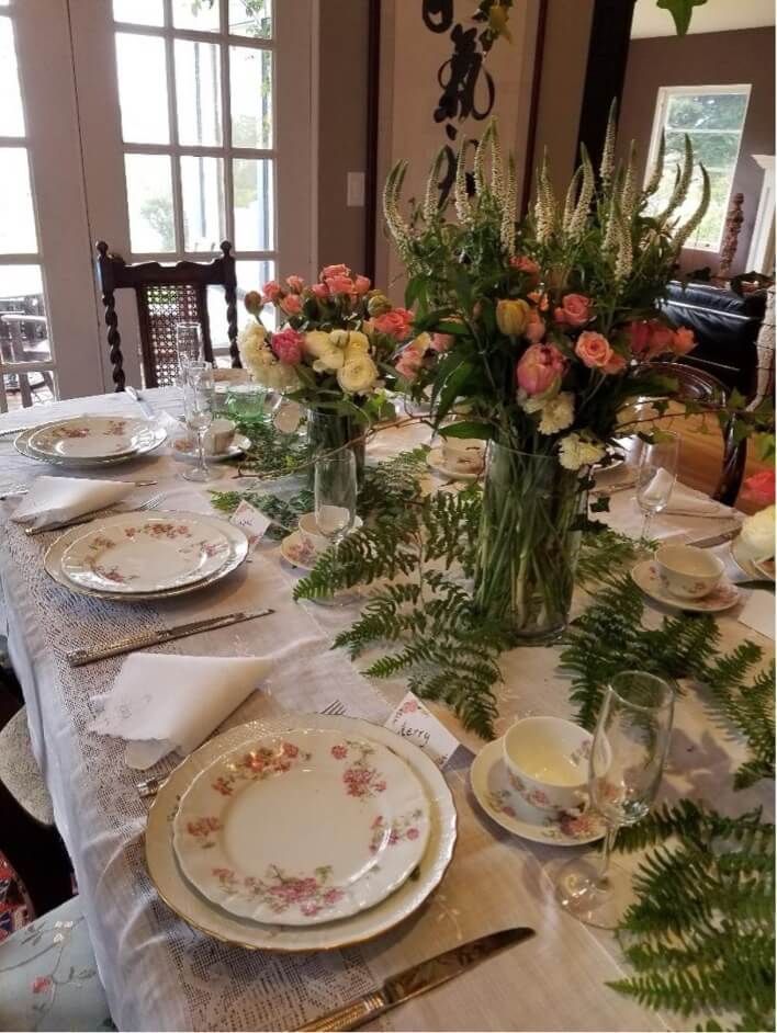 Elegant table setting with floral centerpiece.