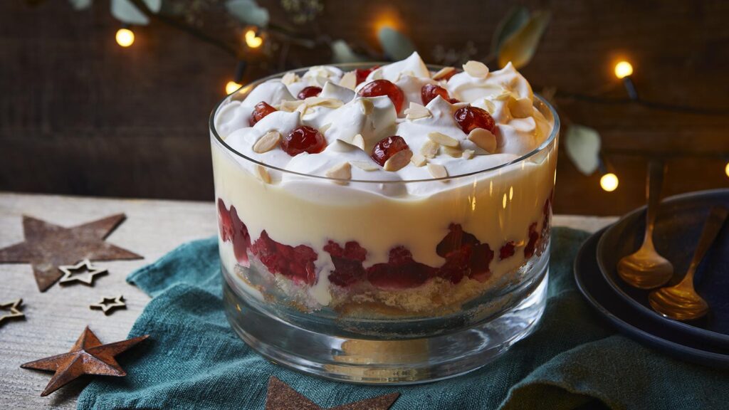 Festive trifle dessert in glass bowl.